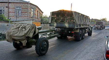 Georgian soldiers sit in military vehicles near the city of Tskhinvali, 100 km (62 miles) from Tbilisi, August 8, 2008. (Xinhua/Reuters Photo)