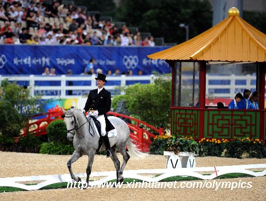 New Zealand's rider Mark Todd rides his horse Gandalf during eventing dressage competition held at Hong Kong Olympic Equestrian Venue (Sha Tin) in the Olympic co-host city of Hong Kong, south China, Aug. 9, 2008.