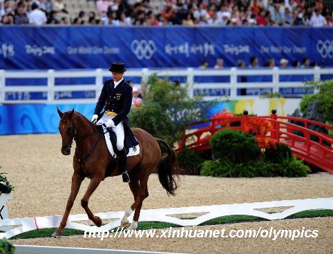 Germany's rider Peter Thomsen rides on his horse during eventing dressage competition held at Hong Kong Olympic Equestrian Venue (Sha Tin) in the Olympic co-host city of Hong Kong, south China, Aug. 9, 2008. 