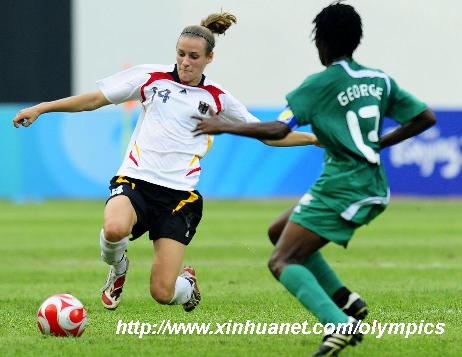 Simone Laudehr (L) of Germany vies for the ball with Christie George of Nigeria during the Beijing Olympic women's football tournament Group F match between Germany and Nigeria in Shenyang, Olympic co-host city in northeast China's Liaoning Province, Aug. 9, 2008. (Xinhua/Ren Yong)