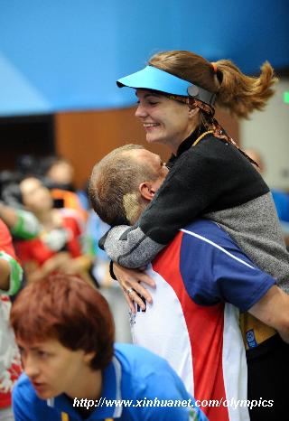 Markswoman Katerina Emmons (R) of Czech celebrates after women's 10m Air rifle final of Beijing Olympic Games at Beijing Shooting Range Hall in Beijing, China, Aug. 9, 2008. Katerina Emmons won the gold medal in the event with 503.5 points. [Xinhua]f
