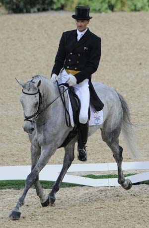 New Zealand's rider Mark Todd rides on his horse during eventing dressage competition held at Hong Kong Olympic Equestrian Venue (Sha Tin) in the Olympic co-host city of Hong Kong, south China, Aug. 9, 2008.