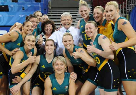 Australian Prime Minister Kevin Rudd (C) posses with Australian women's basketball players after their match agaist Belarussia during women's preliminary round group A of Olympic basketball event at Beijing 2008 Olympic Games at the Beijing Olympic Basketball Gymnasium in Beijing, China, Aug. 9, 2008. Australia beat Belarussia 83-64.(Xinhua/Li Jundong)