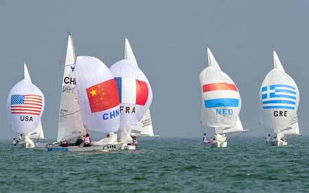 Sailors compete during Yngling Class competition at Qingdao Olympic Sailing Centre in Qingdao, an Olympic co-host city in east China's Shandong Province, Aug. 9, 2008.