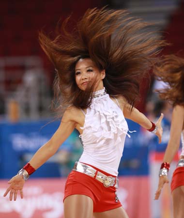 Cheering squad perform for women's basketball