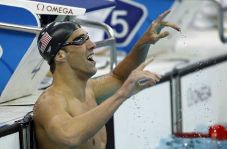 Phelps wins first swimming gold with world record