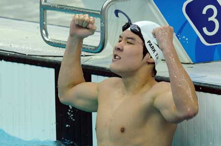 Park Tae-hwan of South Koera celebrates victory during men’s 400 freestyle final of the Beijing 2008 Olympic Games at National Aquatics Center in Beijing, China, August 10, 2008. Park won the gold medal in the event. [Xinhua/Chen Kai]