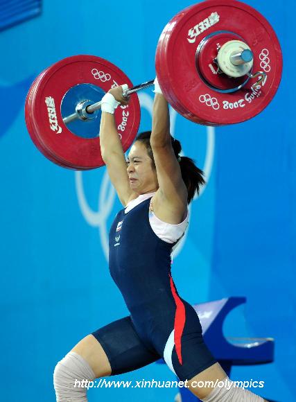 Prapawadee Jaroenrattanatarakoon of Thailand takes a lift at the women's 53kg final of weightlifting at Beijing 2008 Olympic Games in Beijing, China, Aug. 10, 2008. Prapawadee claimed title in this event and set a new Olympic record with 126 kilos in clean and jerk lift. 