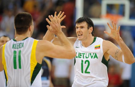 Players of Lithuania celebrate the victory after Men's Preliminary Round Group A game 10 between Argentina and Lithuania of Beijing 2008 Olympic Games basketball event at the Beijing Olympic Basketball Gymnasium in Beijing, China, Aug. 10, 2008. Lithuania beat Argentina 79-75. (Xinhua/Li Jundong)
