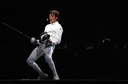 Matteo Tagliariol of Italy celebrates his victory over Fabrice Jeannet of France during men's individual epee final of Beijing 2008 Olympic Games fencing event at Fencing Hall of National Convention Center in Beijing, China, Aug. 10, 2008. Matteo Tagliariol won the gold medal of men's individual epee of Beijing 2008 Olympic Games fencing event.