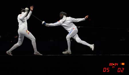 Jose Luis Abajo (L) of Spain competes against Matteo Tagliariol of Italy during men's individual epee semifinal of Beijing 2008 Olympic Games fencing event at Fencing Hall of National Convention Center in Beijing, China, Aug. 10, 2008. Matteo Tagliariol of Italy won 15-12 and qualified the final. 