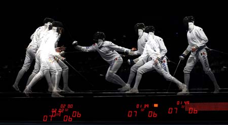 Jose Luis Abajo (L) of Spain competes against Matteo Tagliariol of Italy during men's individual epee semifinal of Beijing 2008 Olympic Games fencing event at Fencing Hall of National Convention Center in Beijing, China, Aug. 10, 2008. Matteo Tagliariol of Italy won 15-12 and qualified the final.