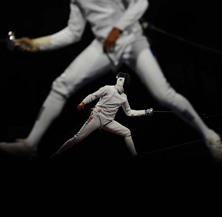 Sturla Torkildsen (rear) of Norway competes against Matteo Tagliariol of Italy during men's individual epee round of 32 of Beijing 2008 Olympic Games fencing event at Fencing Hall of National Convention Center in Beijing, China, Aug. 10, 2008. Matteo Tagliariol of Italy qualified next round. 