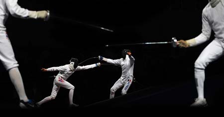 Sturla Torkildsen (L) of Norway competes against Matteo Tagliariol of Italy during men's individual epee round of 32 of Beijing 2008 Olympic Games fencing event at Fencing Hall of National Convention Center in Beijing, China, Aug. 10, 2008. Matteo Tagliariol of Italy qualified next round.