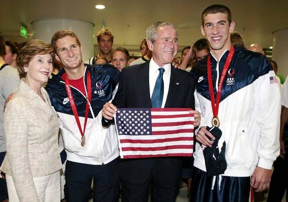 US president Goerge W. Bushes and the US first lady Laura Bush congratulate Michael Phelps and Ryan Lochte after they got a gold and bronze medal respectively in the swimming 400m medley final. Phelps also shattered the world with a with 4 minutes 3.84 seconds finish.