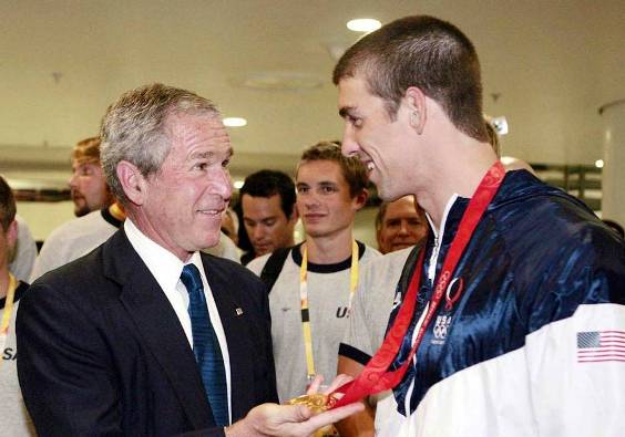 US president Goerge W. Bushes and the US first lady Laura Bush congratulate Michael Phelps and Ryan Lochte after they got a gold and bronze medal respectively in the swimming 400m medley final. Phelps also shattered the world with a with 4 minutes 3.84 seconds finish.