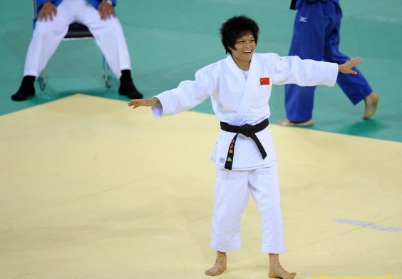 Xian Dongmei of China celebrates after defeating An Kum Ae of the Democratic People’s Republic of Korea during the women -52 kg final of judo at the Beijing Olympics in Beijing, China, Aug. 10, 2008. Xian Dongmei gained the gold medal of the event.