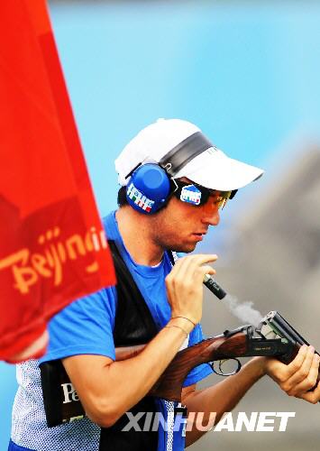 An Italian shooter is reloading the gun after two shots