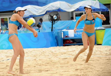 Simone Kuhn (r) and Lea Schwer of Switzerland compete during the women's preliminary pool A of the Beijing 2008 Olympic Games beach volleyball event against Kathrine Maaseide and Susanne Glesnes of Norway in Beijing, China, Aug. 11, 2008. Kathrine Maaseide and Susanne Glesnes of Norway won the match 2-0. (Xinhua/Sadat)