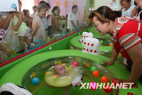 In order to celebrate the Olympic Games currently being held in Beijing, an infant swimming competition was held on Sunday, August 10, 2008, in Kaifeng in central Henan Province. Some 50 babies aged from 15 days to 1 year took part in the competition.