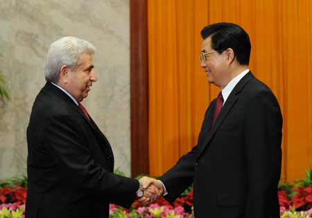 Chinese President Hu Jintao (R) shakes hands with President of Cyprus Demetris Christofias during their meeting in Beijing, China, Aug. 11, 2008. Demetris Christofias attended the opening ceremony of the Beijing Olympic Games on Aug. 8. 