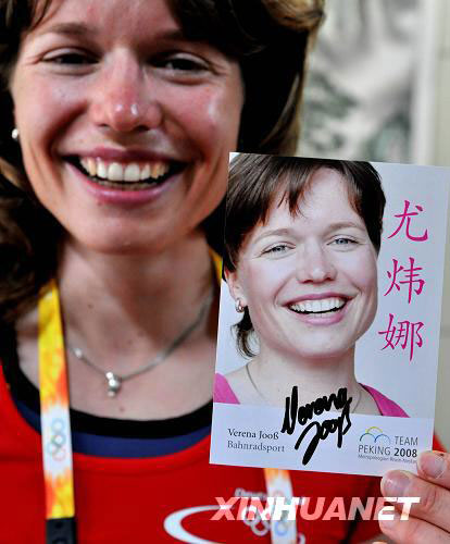 Verena Joos, a German cyclist in the Beijing Summer Olympics, shows a picture of herself printed with her new Chinese name in the Beijing Olympic Village on Sunday, August 10, 2008. Joos said she will grab any free time to learn Chinese. 