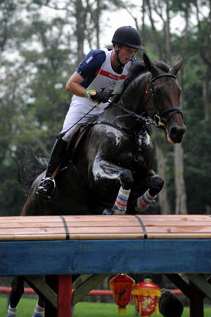 Czech rider Jaroslav Hatla rides his horse Karla during eventing cross country competition held at Hong Kong Olympic Equestrian Venue (Beas River) in the Olympic co-host city of Hong Kong, south China, Aug. 11, 2008. (Xinhua/Lo Ping Fai) 