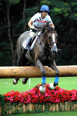 US rider Gina Miles rides her horse Mckinlaigh during eventing cross country competition held at Hong Kong Olympic Equestrian Venue (Beas River) in the Olympic co-host city of Hong Kong, south China, Aug. 11, 2008. (Xinhua/Lo Ping Fai)