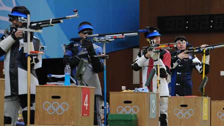 Abhinav Bindra of India (1st L) and Zhu Qinan of China (2nd R) compete during men's 10m air rifle final of Beijing Olympic Games at Beijing Shooting Range Hall in Beijing, China, Aug. 11, 2008. Abhinav Bindra of India won the gold medal in the event followed by Zhu Qinan as the runner-up. [Jiao Weiping/Xinhua]