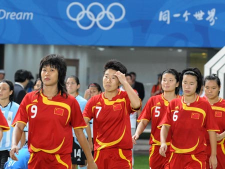 The starting lineup of China enter into the filed during Women's First Round-Group E-Match 15 between China and Argentina of Beijing 2008 Olympic Games football event at QHD Stadium in Qinhuangdao, an Olympic co-host city in north China's Hebei Province, Aug. 12, 2008.
