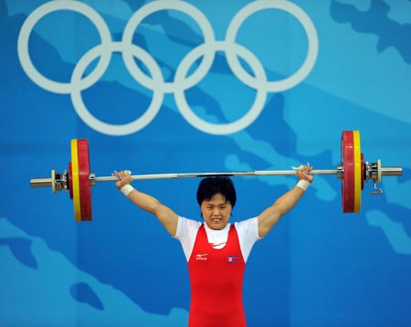 Pak Hyon Suk of the Democratic People's Republic of Korea (DPRK) takes a lift at the women's 63kg final of weightlifting at Beijing 2008 Olympic Games in Beijing, China, Aug. 12, 2008. Pak Hyon Suk won the gold medal in this event with a total of 241 kilos. 