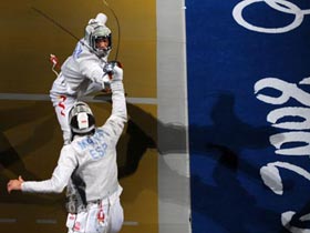 Zhong Man (rear) of China fights with Jaime Marti of Spain during their match at the men's individual sabre round of 16 of the Beijing 2008 Olympic Games fencing event at the Fencing Hall of National Convention Center in Beijing, Aug 12, 2008.