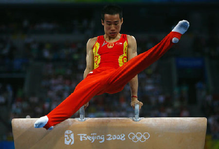 Xiao Qin performs in the Olympic men's gymnastics team competition.