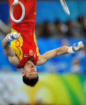  China&apos;s Yang Wei performs the rings during gymnastics artistic men&apos;s team final of the Beijing 2008 Olympic Games at National Indoor Stadium in Beijing, China, Aug. 12, 2008. (Xinhua/Cheng Min)