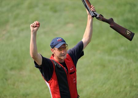 Walton Eller of the United States celebrates his victory during men's double trap final of the Beijing 2008 Olympic Games shooting event in Beijing, China, Aug 12, 2008. The United States's Walton Eller won the gold medal with a total score of 190, follewed by Italy's Francesco D Aniello of 187 and China's Hu Binyuan of 184. [Li Ga/Xinhua]