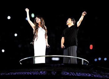 A simple but gentle rhythm and warm lyrics were close to the Olympic soul and Chinese heart, said singer Liu Huan, about the theme song he and British warbler Sarah Brightman presented at the Beijing Games' opening ceremony.  
