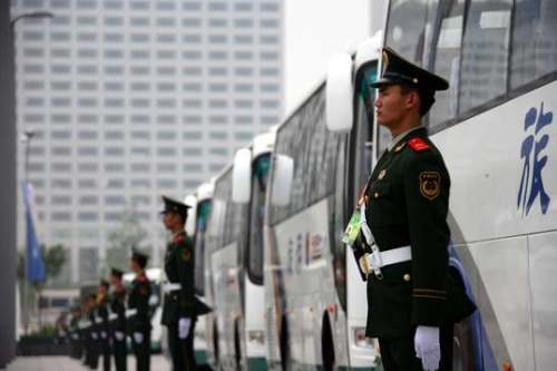 Armed police are guarding the athletes' shuttle bus. [Xinhua]