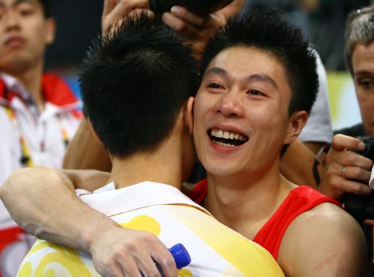 China's formidable male gymnasts stormed to a long-awaited Olympic team gold medal before an ecstatic home crowd on Tuesday. They claimed the title at 286.125 points, beating defending Olympic champion Japan to second place by a comfortable margin of 7.25 points. The United States took the bronze in 275.850 points. [Xinhua]