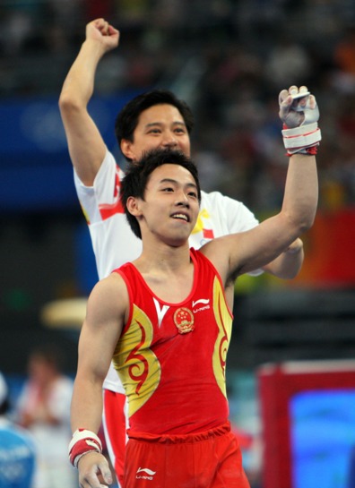 China's formidable male gymnasts stormed to a long-awaited Olympic team gold medal before an ecstatic home crowd on Tuesday. They claimed the title at 286.125 points, beating defending Olympic champion Japan to second place by a comfortable margin of 7.25 points. The United States took the bronze in 275.850 points. [Xinhua]