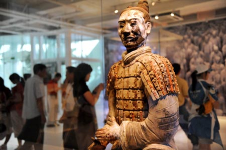 A Terracotta Warrior is displayed at an exhibiting center in the Olympic Green in Beijing, China, Aug. 11, 2008. Five genuine Terracotta Warriors and Horses, transported from Xi'an, capital of northwest China's Shaanxi Province, are displayed at the center, making it a place for foreign coaches, athletes and tourists to learn Chinese culture. (Xinhua/Li Ziheng)