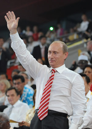 Russian Prime Minister Vladimir Vladimirovic Putin waves to the Olympic delegation of Russia at the opening ceremony of the Beijing Olympics in the National Stadium in north Beijing, China, Aug. 8, 2008. (Xinhua/Huang Jingwen)