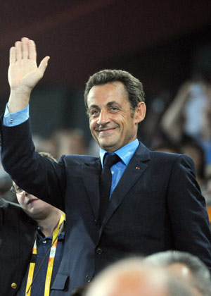 French President Nicolas Sarkozy waves to the Olympic delegation of France at the opening ceremony of the Beijing Olympics in the National Stadium in north Beijing, China, Aug. 8, 2008. (Xinhua/Huang Jingwen)