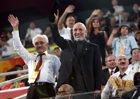 President of Afghanistan Hamid Karzai (R) waves to the Olympic delegation of Afghanistan at the opening ceremony of the Beijing Olympics in the National Stadium in north Beijing, China, Aug. 8, 2008. (Xinhua/Yao Dawei) 