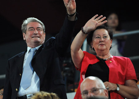 Albanian Prime Minister Sali Berisha (L) and his wife wave to the Olympic delegation of Albania at the opening ceremony of the Beijing Olympics in the National Stadium in north Beijing, China, Aug. 8, 2008. (Xinhua/Huang Jingwen)