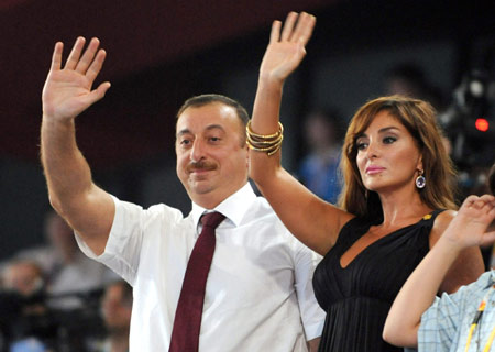 Azerbaijani President Ilham Aliyev and his wife wave to the Olympic delegation of Azerbaijan at the opening ceremony of the Beijing Olympics in the National Stadium in north Beijing, China, Aug. 8, 2008. (Xinhua/Huang Jingwen) 