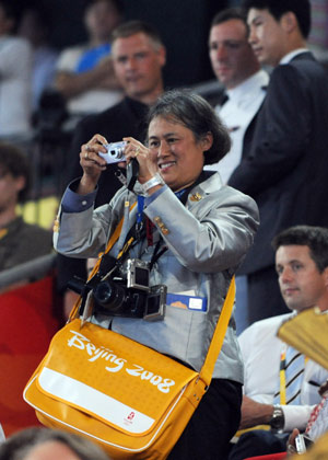 Thai Princess Maha Chakri Sirindhorn takes photos at the opening ceremony of the Beijing Olympics in the National Stadium in north Beijing, China, Aug. 8, 2008. (Xinhua/Huang Jingwen)