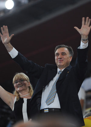 President of the Republic of Montenegro Filip Vujanovic waves to the Olympic delegation of Montenegro at the opening ceremony of the Beijing Olympics in the National Stadium in north Beijing, China, Aug. 8, 2008. (Xinhua/Zhao Peng)