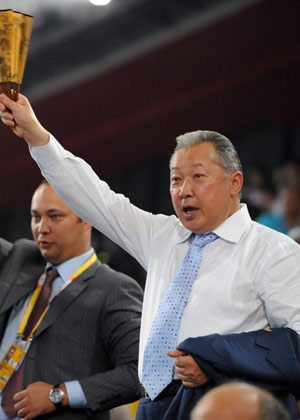 Kyrgyz President Kurmanbek Bakiyev waves to the Olympic delegation of Kyrgyzstan