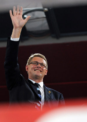 Finnish Prime Minister Matti Vanhanen waves to the Olympic delegation of Finland at the opening ceremony of the Beijing Olympics in the National Stadium in north Beijing, China, Aug. 8, 2008. (Xinhua/Huang Jingwen) 