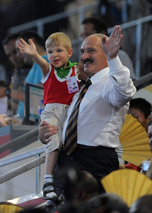 President of Belarus Alexander Lukashenko waves to the Olympic delegation of Belarus